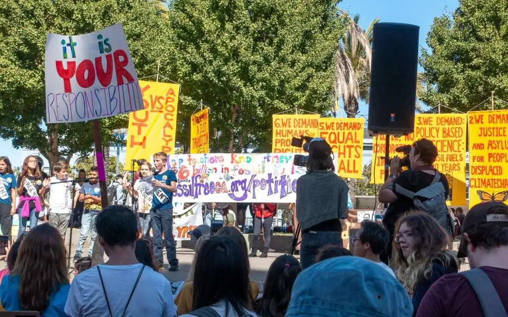 Young demonstator speaking at climate change rally